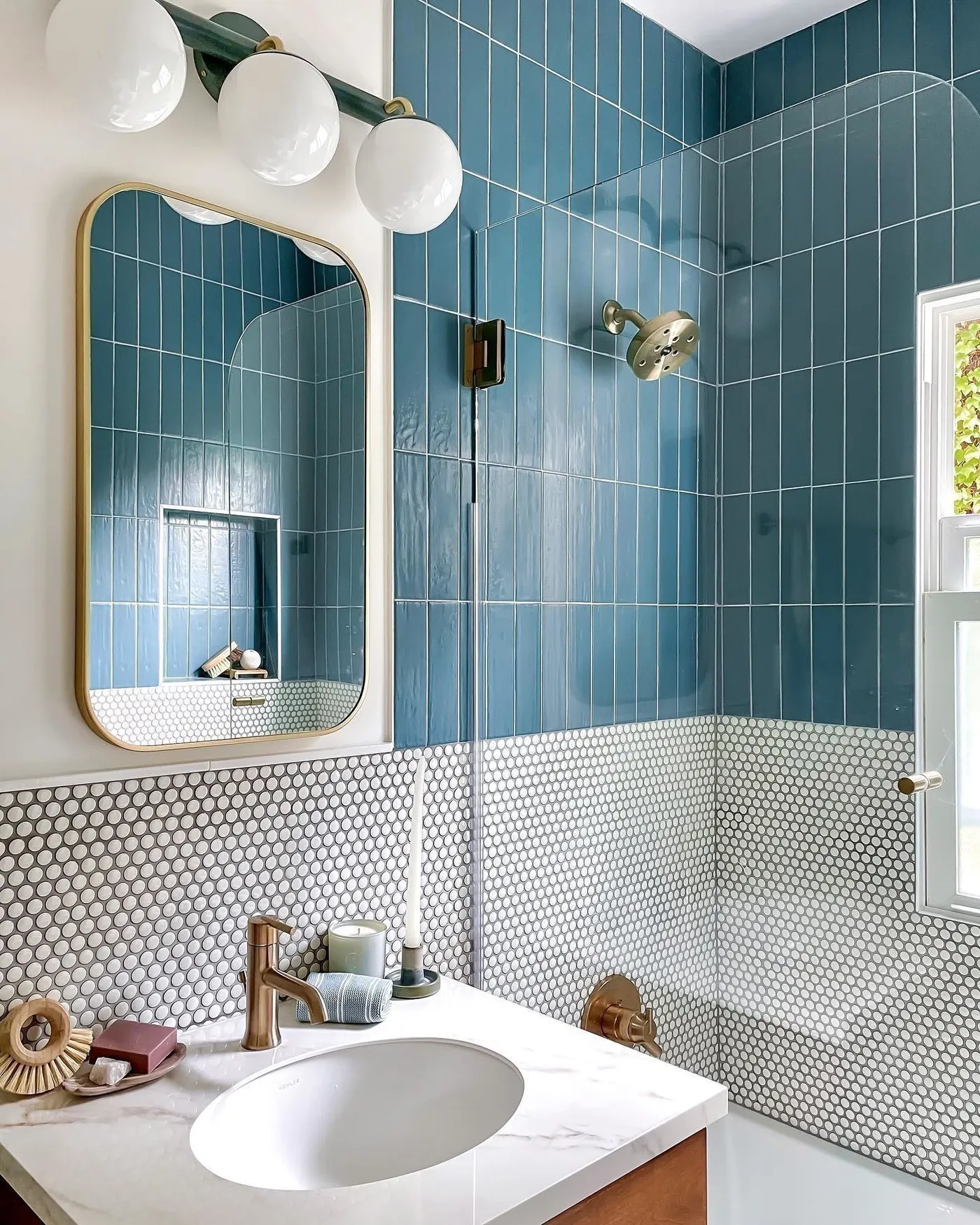 Warm metals against blue tile