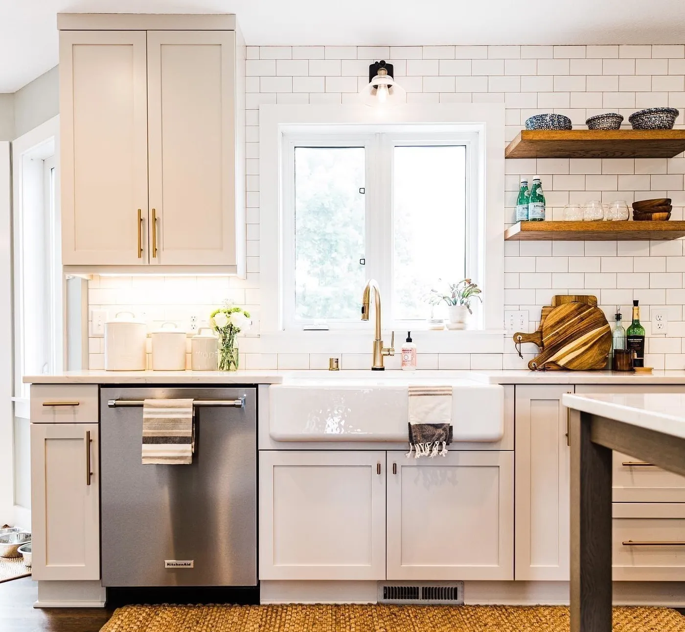 White kitchen with subway tile and apron sink